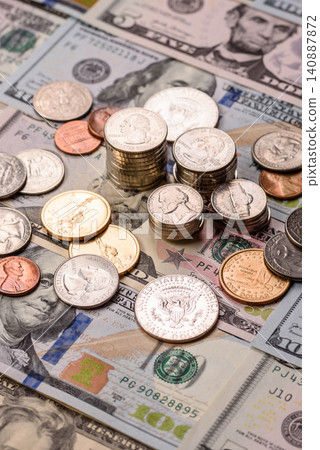 Paper US dollar bills of various denominations and cent coins as a business tool. Cash US dollars 140887872