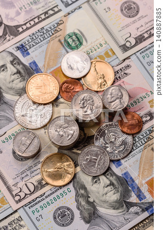 Paper US dollar bills of various denominations and cent coins as a business tool. Cash US dollars Paper US dollar bills of various denominations and cent coins as a business tool. Cash US dollars 140887885