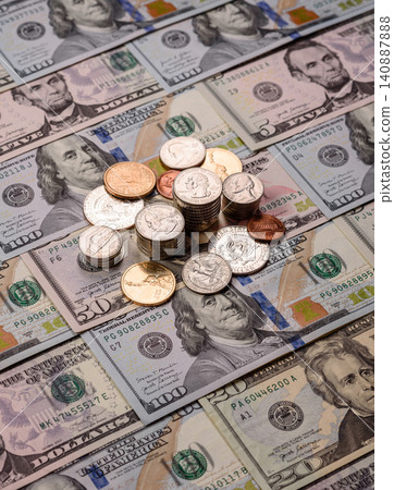 Paper US dollar bills of various denominations and cent coins as a business tool. Cash US dollars Paper US dollar bills of various denominations and cent coins as a business tool. Cash US dollars 140887888