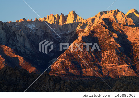Sierra nevada mountain sunrise california alpine peak glow over rugged granite range and scenic valley with warm golden light Sierra nevada mountain sunrise california alpine peak glow over rugged granite range and scenic valley with warm golden light 140889005