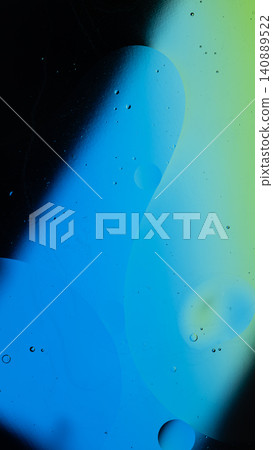 Oil drops creating an abstract liquid background with a bright blue and green gradient Oil drops creating an abstract liquid background with a bright blue and green gradient 140889522