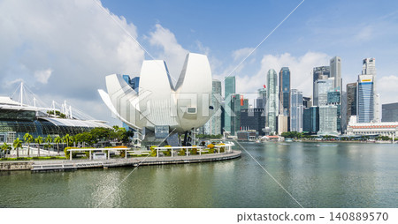 The Art Science Museum in Marina Bay, Singapore, with a skyscraper building background. The museum features exhibitions that include art, science, culture, and technology. The Art Science Museum in Marina Bay, Singapore, with a skyscraper building background. The museum features exhibitions that include art, science, culture, and technology. 140889570
