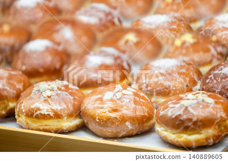Traditional donuts with almonds and powdered sugar Traditional donuts with almonds and powdered sugar 140889605