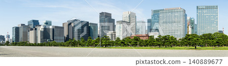 Panoramic view of the many pine trees around the Kokyo Gaien gardens, with the Marunouchi modern office building background in Chiyoda, Tokyo, Japan.  140889677