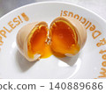 A soft-boiled egg on a plate 140889686