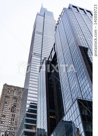 Business building skyscraper in city. City downtown with skyscraper. Architecture. Skyscraper building architecture. Skyscraper in business district. Modern building in city. Business concept 140889723