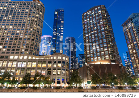 City night illuminated building. Skyscraper cityscape. Night city of Chicago. Business city. Night cityscape of Chicago skyscraper building. Chicago architecture of skyscraper. Glittering skyline City night illuminated building. Skyscraper cityscape. Night city of Chicago. Business city. Night cityscape of Chicago skyscraper building. Chicago architecture of skyscraper. Glittering skyline 140889729