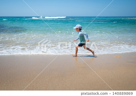 5-Year-Old Boy Running Playfully Along the Shoreline in Sri Lanka 5-Year-Old Boy Running Playfully Along the Shoreline in Sri Lanka 140889869
