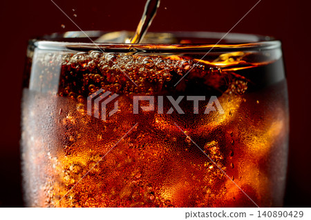 Fizz sparkling cola bubbly soda pop with ice cubes. 140890429