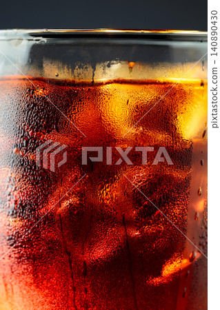 Fizz sparkling cola bubbly soda pop with ice cubes. 140890430