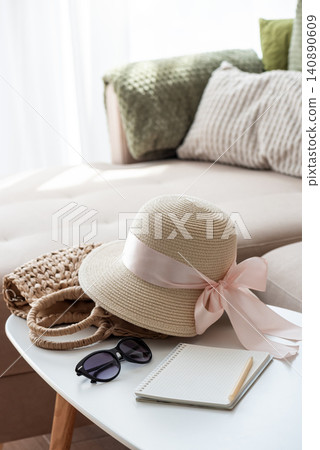 Straw hat and travel accessories for summer vacation planning Straw hat and travel accessories for summer vacation planning 140890609