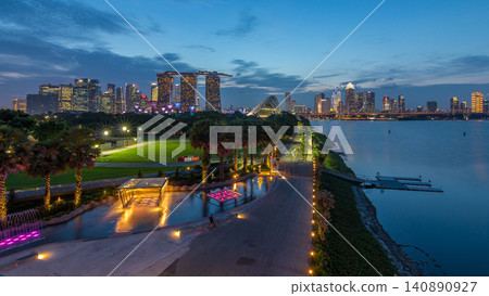 Singapore skyline panorama near Gardens by the bay with cloud forest, flower dome and supertrees day to night timelapse after sunset Singapore skyline panorama near Gardens by the bay with cloud forest, flower dome and supertrees day to night timelapse after sunset 140890927