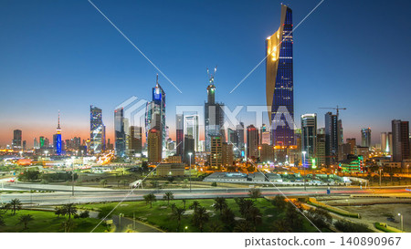 Skyline with Skyscrapers day to night timelapse in Kuwait City downtown illuminated at dusk. Kuwait City, Middle East Skyline with Skyscrapers day to night timelapse in Kuwait City downtown illuminated at dusk. Kuwait City, Middle East 140890967