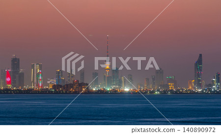 Skyline with Skyscrapers day to night timelapse in Kuwait City downtown illuminated at dusk. Kuwait City, Middle East Skyline with Skyscrapers day to night timelapse in Kuwait City downtown illuminated at dusk. Kuwait City, Middle East 140890972