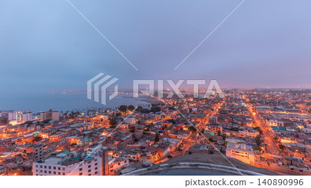 Panoramic skyline of Lima city from above with many buildings aerial night to day transition timelapse. Lima, Peru 140890996