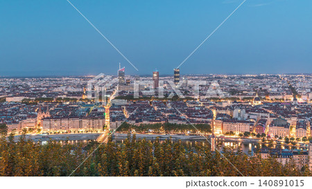 Panoramic aerial view of Lyon after sunset from Fourviere Hill day to night transition. France Panoramic aerial view of Lyon after sunset from Fourviere Hill day to night transition. France 140891015