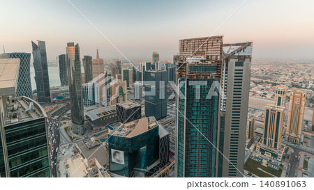 The skyline of the West Bay area from top in Doha night to day timelapse, Qatar. The skyline of the West Bay area from top in Doha night to day timelapse, Qatar. 140891063