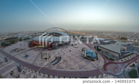 Aerial view of Aspire Zone stadium from top night to day timelapse in Doha Aerial view of Aspire Zone stadium from top night to day timelapse in Doha 140891075