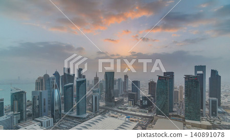 Skyscrapers at sunset timelapse in the skyline of commercial center of Doha, the capital Qatar Skyscrapers at sunset timelapse in the skyline of commercial center of Doha, the capital Qatar 140891078