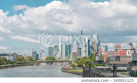 Hyperlapse of Frankfurt's Main Iron Footbridge against the financial district skyscrapers skyline on a sunny day with clouds timelapse. Frankfurt, Germany Hyperlapse of Frankfurt's Main Iron Footbridge against the financial district skyscrapers skyline on a sunny day with clouds timelapse. Frankfurt, Germany 140891125