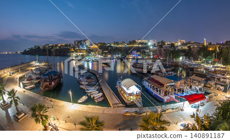 Aerial view of yacht harbor and red house roofs in Old town day to night timelapse Antalya, Turkey. Aerial view of yacht harbor and red house roofs in Old town day to night timelapse Antalya, Turkey. 140891187