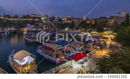 Aerial view of yacht harbor and red house roofs in "Old town" day to night timelapse Antalya, Turkey. Aerial view of yacht harbor and red house roofs in "Old town" day to night timelapse Antalya, Turkey. 140891188
