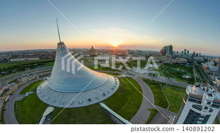 Elevated view with sunrise over the city center with Khan Shatyr and central business district timelapse, Kazakhstan, Astana Elevated view with sunrise over the city center with Khan Shatyr and central business district timelapse, Kazakhstan, Astana 140891202