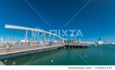 Rambla de Mar wooden walkway timelapse over Port Vell in the city of Barcelona at day in Catalonia, Spain. Rambla de Mar wooden walkway timelapse over Port Vell in the city of Barcelona at day in Catalonia, Spain. 140891207