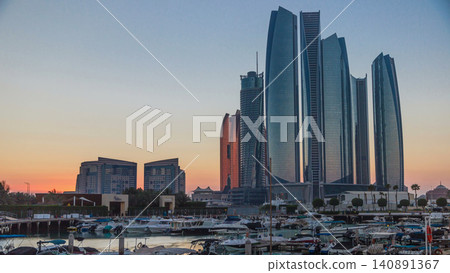 Al Bateen marina Abu Dhabi timelapse with modern skyscrapers on background Al Bateen marina Abu Dhabi timelapse with modern skyscrapers on background 140891367