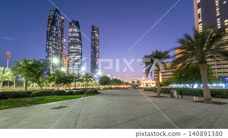 Skyscrapers of Abu Dhabi with Etihad Towers buildings day to night timelapse. 140891380
