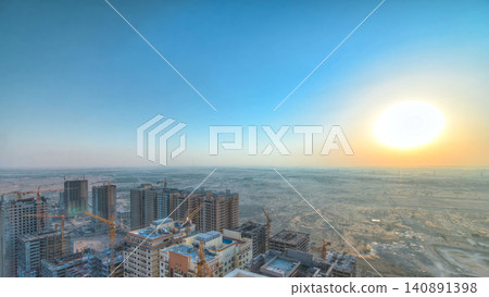 Cityscape of Ajman from rooftop during sunrise timelapse. United Arab Emirates. Cityscape of Ajman from rooftop during sunrise timelapse. United Arab Emirates. 140891398