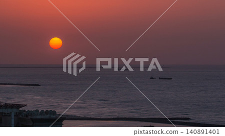 Sunset in Ajman aerial view from rooftop timelapse. United Arab Emirates. Sunset in Ajman aerial view from rooftop timelapse. United Arab Emirates. 140891401