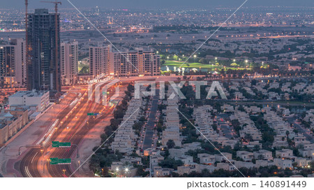 Jumeirah Lake Towers residential district aerial day to night timelapse near Dubai Marina Jumeirah Lake Towers residential district aerial day to night timelapse near Dubai Marina 140891449