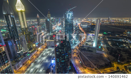 Skyline of the buildings of Sheikh Zayed Road and DIFC aerial night timelapse in Dubai, UAE. Skyline of the buildings of Sheikh Zayed Road and DIFC aerial night timelapse in Dubai, UAE. 140891462