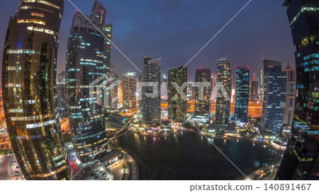 Residential and office buildings in Jumeirah lake towers district day to night timelapse in Dubai Residential and office buildings in Jumeirah lake towers district day to night timelapse in Dubai 140891467
