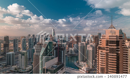 Dubai Marina skyscrapers and jumeirah lake towers view from the top aerial timelapse in the United Arab Emirates. Dubai Marina skyscrapers and jumeirah lake towers view from the top aerial timelapse in the United Arab Emirates. 140891477