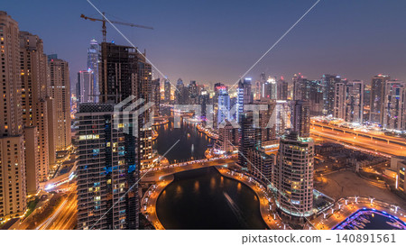 Beautiful aerial top view day to night transition timelapse of Dubai Marina canal Beautiful aerial top view day to night transition timelapse of Dubai Marina canal 140891561