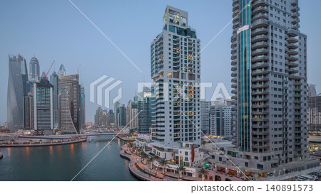 Beautiful aerial top view day to night transition timelapse of Dubai Marina canal Beautiful aerial top view day to night transition timelapse of Dubai Marina canal 140891573
