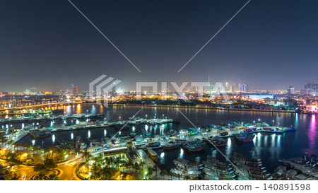 Dubai creek landscape day to night timelapse with boats and ship near waterfront Dubai creek landscape day to night timelapse with boats and ship near waterfront 140891598