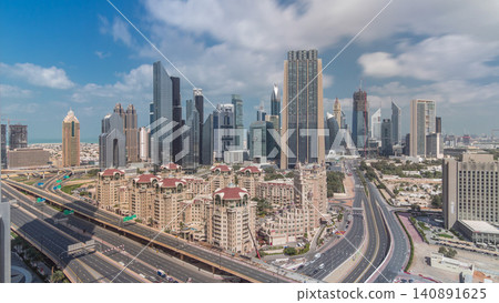 Skyline view of the buildings of Sheikh Zayed Road and DIFC timelapse in Dubai, UAE. Skyline view of the buildings of Sheikh Zayed Road and DIFC timelapse in Dubai, UAE. 140891625