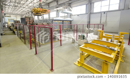 The operator lifting device timelapse, lift loads using lifting magnet, mechanical workshop, metal structures plant. The operator lifting device timelapse, lift loads using lifting magnet, mechanical workshop, metal structures plant. 140891635