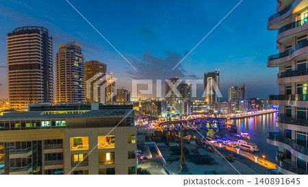 An Aerial view of Dubai Marina towers in Dubai day to night timelapse An Aerial view of Dubai Marina towers in Dubai day to night timelapse 140891645