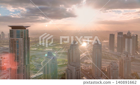 Sunrise in Dubai Marina with towers and harbor with yacht from skyscraper, Dubai, UAE timelapse 140891662