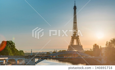 Eiffel Tower sunrise timelapse with boats on Seine river and in Paris, France. 140891718