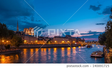 Le Pont D'Arcole bridge after sunset with people and boats day to night timelapse, Paris, France, Europe Le Pont D'Arcole bridge after sunset with people and boats day to night timelapse, Paris, France, Europe 140891725