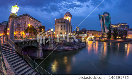 Urania and Danube Canal day to night timelapse in Vienna. Urania and Danube Canal day to night timelapse in Vienna. 140891785