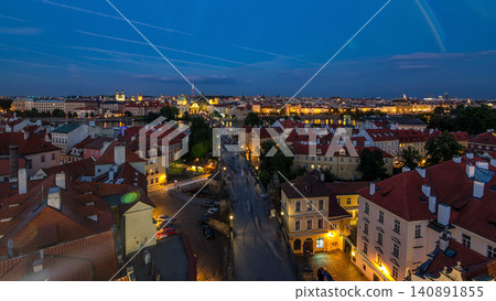 Aerial view of the Old Town architecture and Charles Bridge over Vltava river day to night timelapse in Praha Aerial view of the Old Town architecture and Charles Bridge over Vltava river day to night timelapse in Praha 140891855