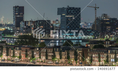 Panoramic aerial timelapse of Katendrecht peninsula at night and Maashaven harbour in Rotterdam, The Netherlands. Panoramic aerial timelapse of Katendrecht peninsula at night and Maashaven harbour in Rotterdam, The Netherlands. 140891877