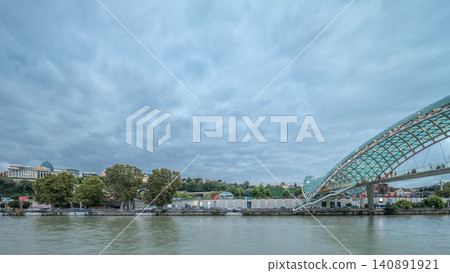 Timelapse panorama of the Bridge of Peace, a bow-shaped pedestrian bridge in Tbilisi, Georgia Timelapse panorama of the Bridge of Peace, a bow-shaped pedestrian bridge in Tbilisi, Georgia 140891921