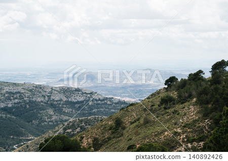 Scenic mountain landscape with cloudy sky and distant horizon Scenic mountain landscape with cloudy sky and distant horizon 140892426